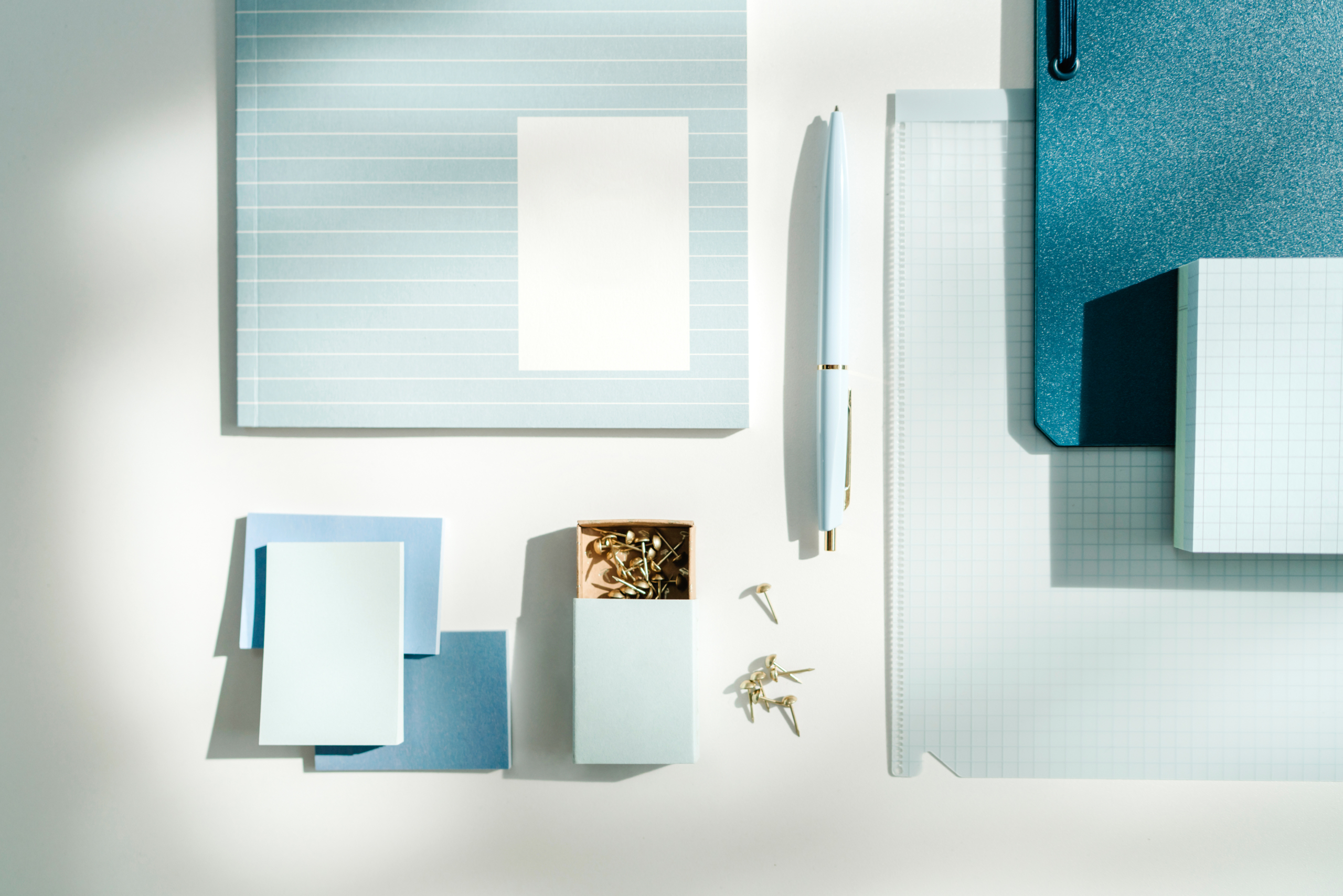 White desk with blue accessories