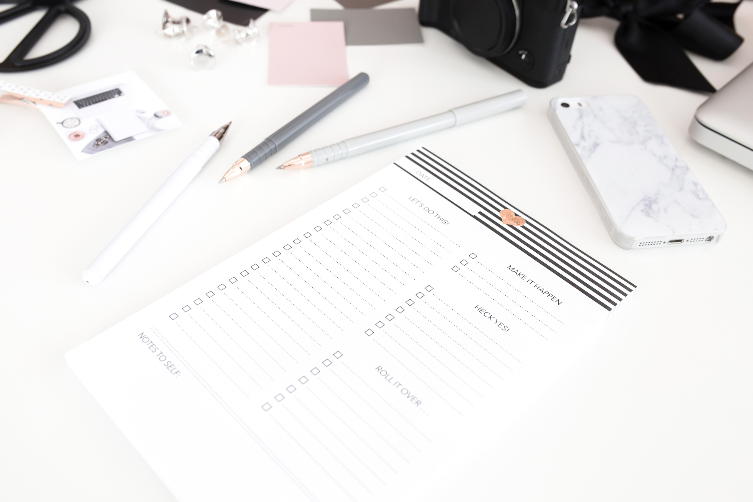 checklist with pens and pencils